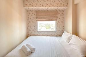 Cozy Living 2BR Green Pramuka City Apartment near Mall By Travelio