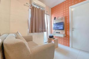 Cozy Living 2BR Green Pramuka City Apartment near Mall By Travelio