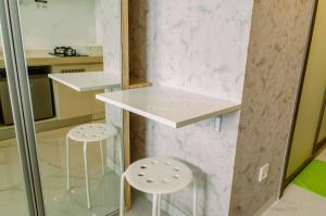 Cozy and Simply Studio at Sky House BSD Apartment By Travelio