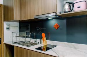 Nice and Comfort 1BR at The Smith Alam Sutera Apartment By Travelio