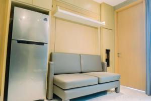 Spacious and Homey 2BR at Tree Park City Cikokol Apartment By Travelio