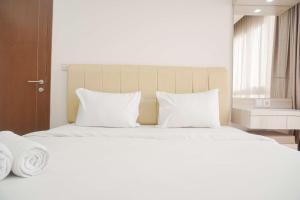 Minimalist and Homey 1BR M-Town Signature Apartment By Travelio