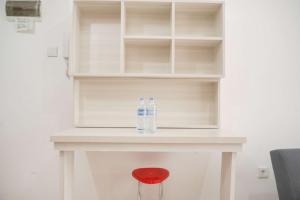 Minimalist and Homey 1BR M-Town Signature Apartment By Travelio