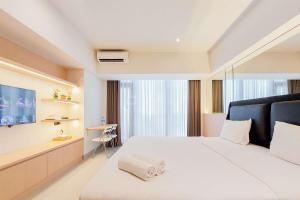 Fancy and Nice Studio Apartment Carstensz Residence By Travelio