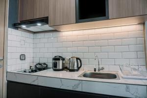 Simply and Cozy Stay Studio Apartment B Residence By Travelio