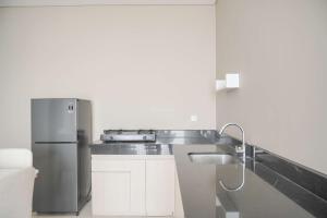 Best Homey and Nice 2BR at Ciputra International Apartment By Travelio