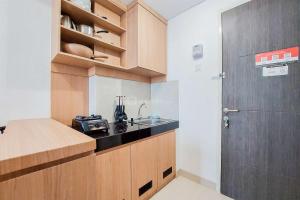 Warm and Cozy Living 2BR Serpong Garden Apartment By Travelio