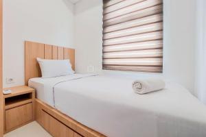 Warm and Cozy Living 2BR Serpong Garden Apartment By Travelio