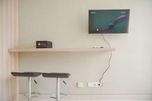 Homey and Warm 1BR at Ciputra International Apartment By Travelio