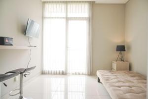 Homey and Warm 1BR at Ciputra International Apartment By Travelio