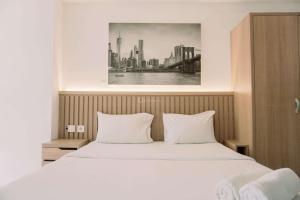 Good and Homey Studio at Pacific Garden Alam Sutera Apartment By Travelio