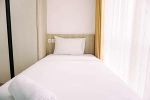 Modern and Homey 2BR Apartment at M-Town Residence By Travelio