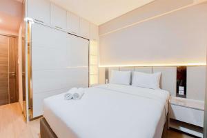 Spacious and Homey 3BR at Sky House BSD Apartment By Travelio