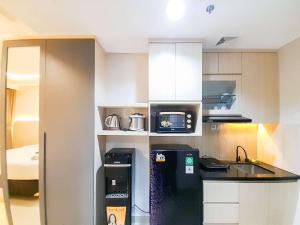 Modern Look and Comfortable Studio at Patraland Amarta Apartment By Travelio