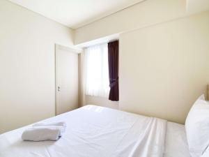 Spacious and Modern 3BR at Meikarta Apartment By Travelio