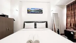 Compact Studio Room Apartment Vida View Makassar By Travelio - Manda