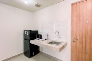 Cozy 1BR (No Kitchen) at Bandaraya - Tallasa City Makassar Apartment By Travelio