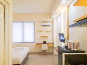 Best Homey and Restful Studio at Altuz Seturan Yogyakarta Apartment By Travelio