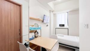 Minimalist Studio (No Kitchen) at Bandaraya - Tallasa City Makassar Apartment By Travelio