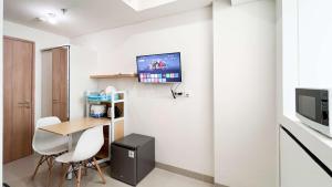 Tranquil Studio (No Kitchen) Apartment Bandaraya - Tallasa City Makassar By Travelio