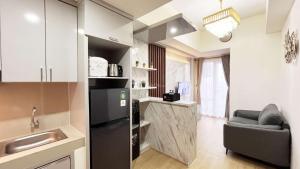 Best Price 2BR Apartment Vida View Makassar By Travelio