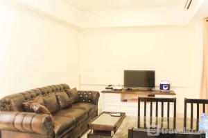 Spacious and Bright 2BR at Meikarta Apartment By Travelio