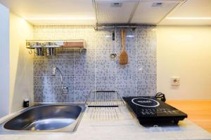 New and Nice Studio at Evenciio Margonda Apartment By Travelio