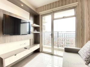 Chic and Cozy 2BR at Mekarwangi Square Cibaduyut Apartment By Travelio