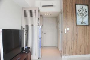 Warm and Cozy Studio at Springlake Summarecon Apartment By Travelio