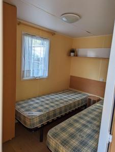 Campings Mobilhome tout confort dans domaine boise : photos des chambres