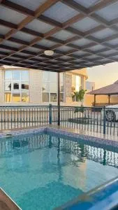 The Rain House - Ţawī ‘Aqdah