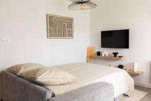 Appartements Douceur de Vivre Urbaine Jonage GROUPAMA STADIUM - ARENA - LYON AEROPORT SAINT EXUPERY - EUREXPO : photos des chambres