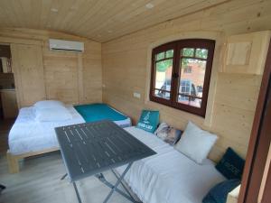 Appartements Roulotte tout confort a la ferme : photos des chambres