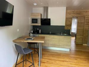 Appartements Logement avec jacuzzi Murat : photos des chambres