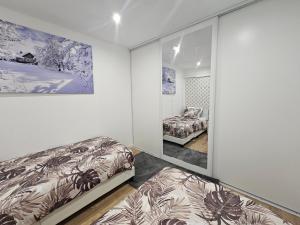 Maisons d'hotes Au Mboa Appartement 2 Chambres au Coeur de Conflans : photos des chambres