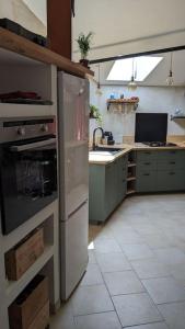 Appartements studio cosy en centre village : photos des chambres