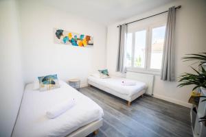 Appartements COSYFAMILY 1er etage Piscine -WIFI- NEUF-FAMILLE -15MIN PLAGE - TOP PROS SERVICESConciergerie : photos des chambres