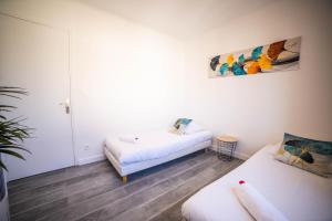 Appartements COSYFAMILY 1er etage Piscine -WIFI- NEUF-FAMILLE -15MIN PLAGE - TOP PROS SERVICESConciergerie : photos des chambres