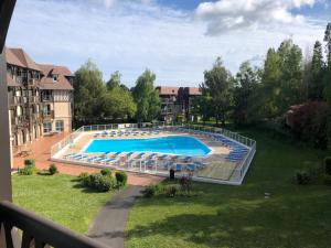 Appartements O Fil de l-eau Deauville piscine chauffee : photos des chambres