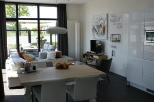 Breskens Chalet TIMEOUT Breskens mit Zaun Hausnr B26