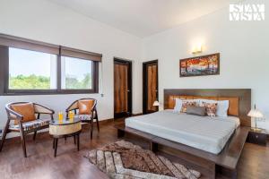 StayVista at The Cityscape With Outdoor Pool