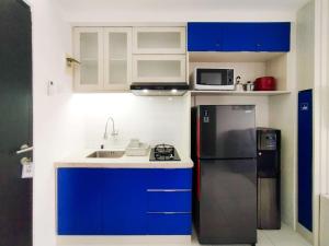 Spaicous 1BR with City View at Grand Asia Afrika Apartment By Travelio