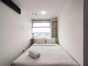 Spaicous 1BR with City View at Grand Asia Afrika Apartment By Travelio