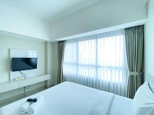 Restful and Simply Studio Springlake Summarecon Bekasi Apartment By Travelio