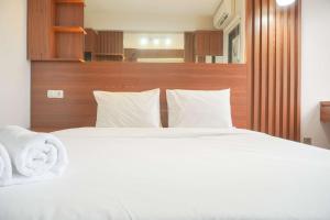 Relaxing and Homey Studio Transpark Cibubur Apartment By Travelio