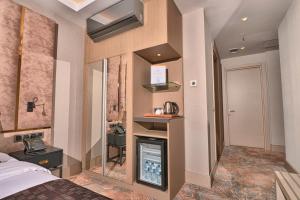 Superior Room with One King Bed and One Single Bed with Balcony and View room in Ottoperla Hotel