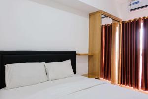 Comfortable 2BR Apartment at M-Town Residence By Travelio