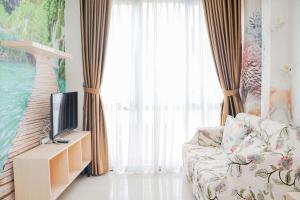 Homey and Relax at 1BR Asatti Apartment By Travelio