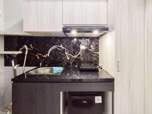 Modern Studio Room Apartment at Grand Asia Afrika By Travelio