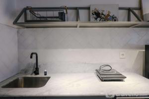 Studio with Private Living Room at Jarrdin Cihampelas Apartment By Travelio